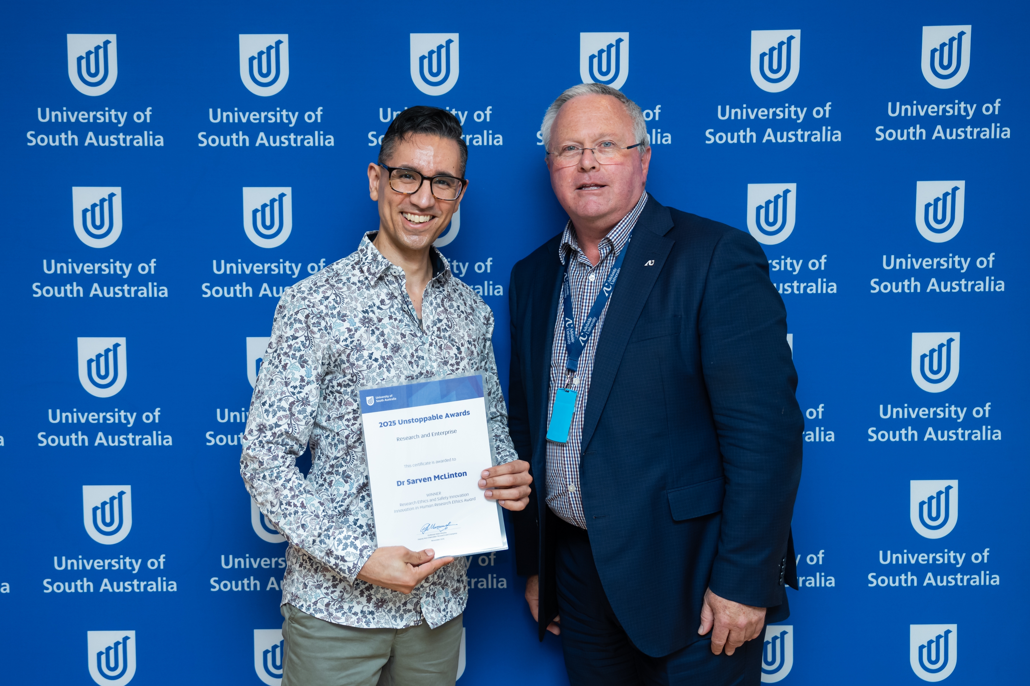 Dr Sarven McLinton is awarded the Human Research Ethics Award by Deputy Vice Chancellor: Research & Enterprise, Professor Peter Murphy