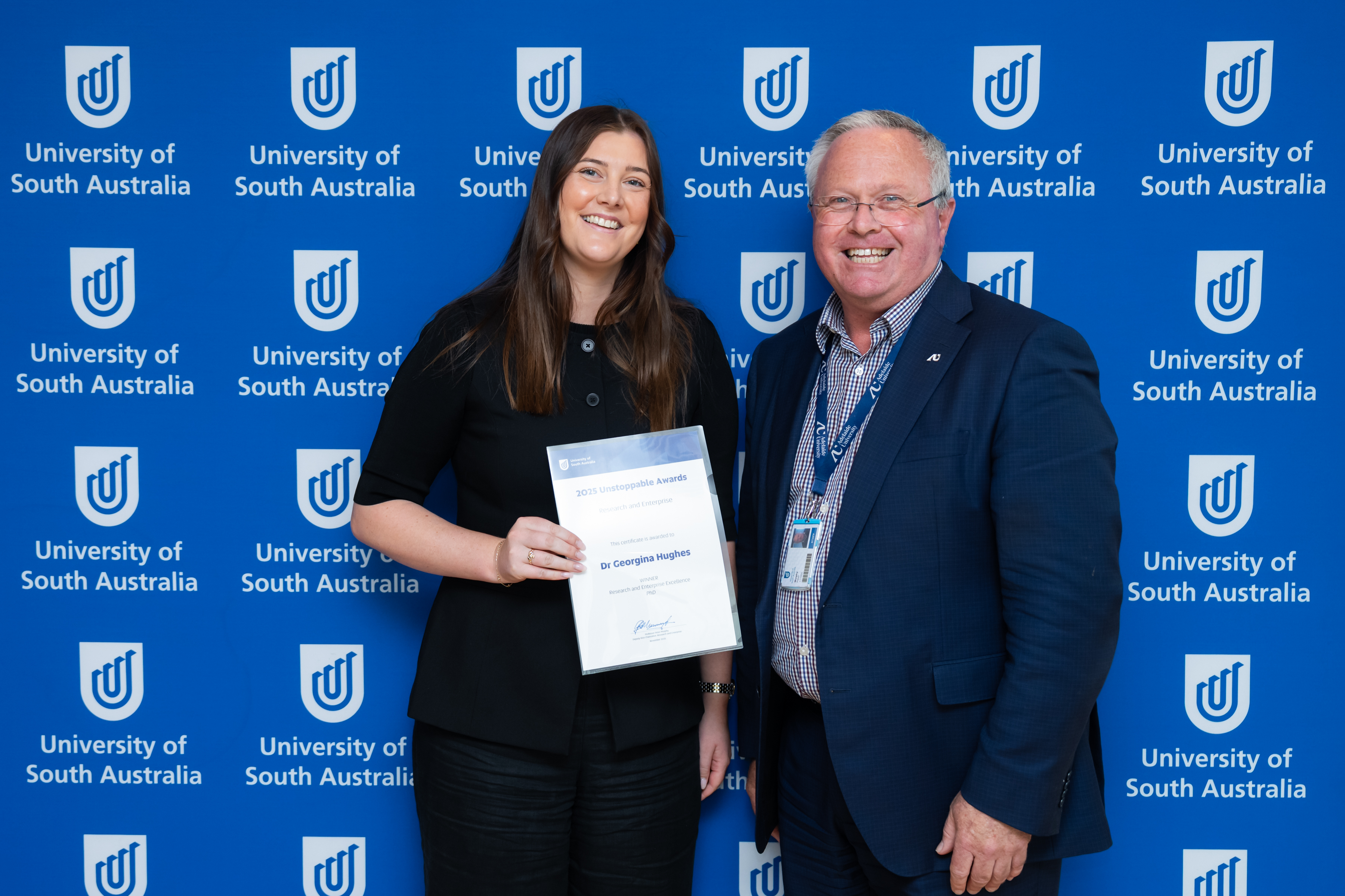 Dr Georgina Hughes is presented the PhD Award by the Deputy Vice Chancellor: Research & Enterprise, Professor Peter Murphy