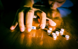 hand reaching for drugs