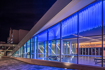 Exterior shot of Pridham Hall illuminated at night