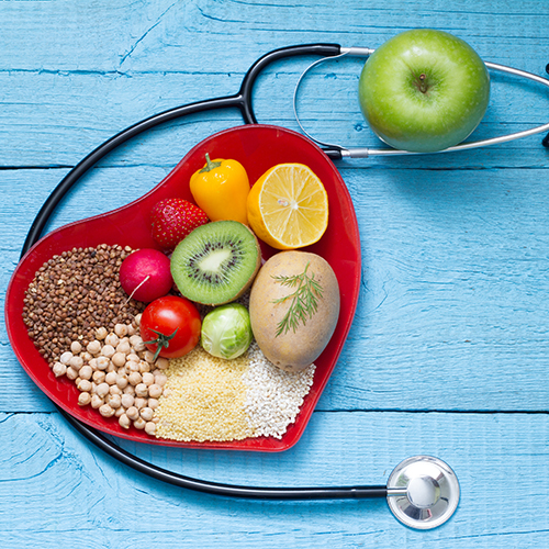 healthy food in a heart shape with a stethoscope