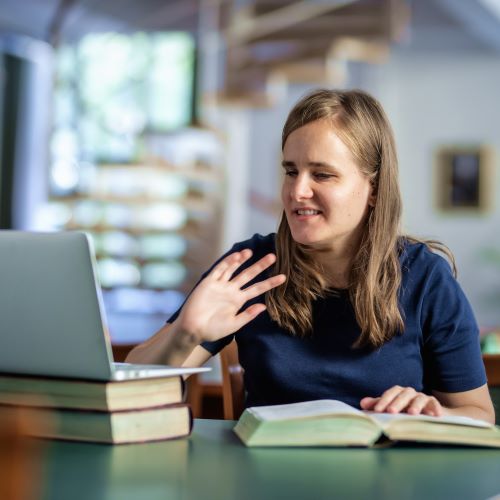 Visually impaired woman in library