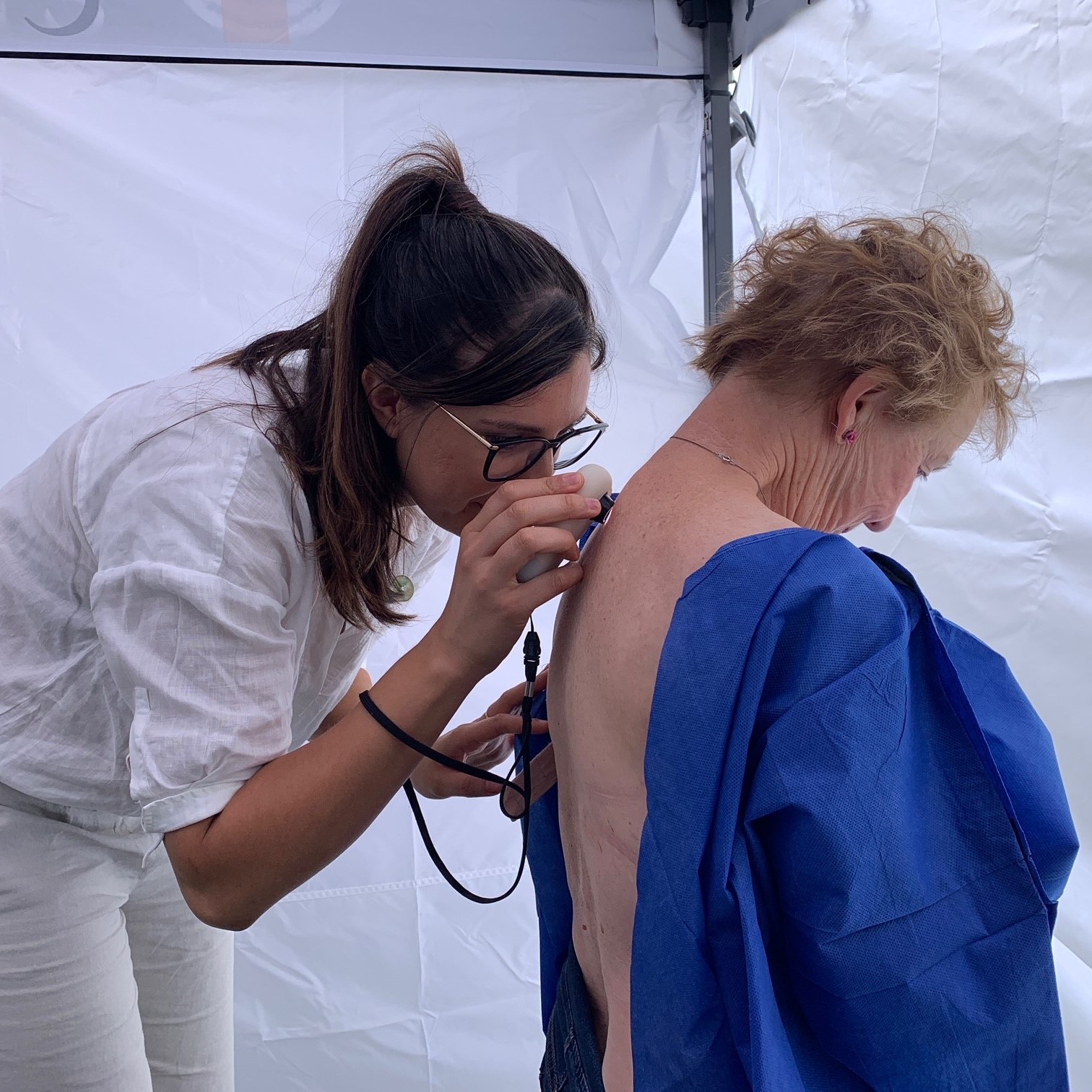 Woman being checked for skin cancer
