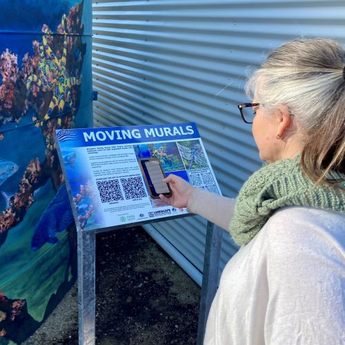 The AR sign next to one of the murals.