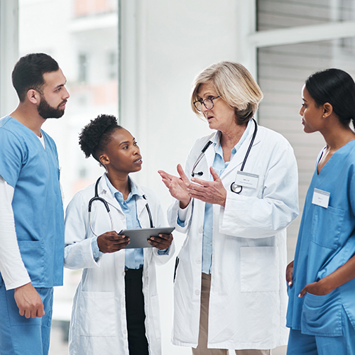 Team of medical professionals talking together