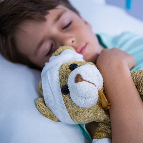 sick child with teddy