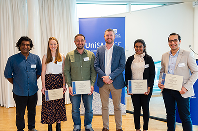 UniSA&rsquo;s Vice Chancellor and President&rsquo;s Scholarship recipients Yusuf Hayat, Ashleigh Hull, Mehmet Yildiz, Chamitha Wijewickrama, Mahmoud Khedher receive their awards from Vice Chancellor Prof David Lloyd (pictured centre).