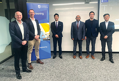Huy Nguyen (third from left) is flanked by Northrop Grumman representatives and UniSA academic supervisor Professor Ke Xing.