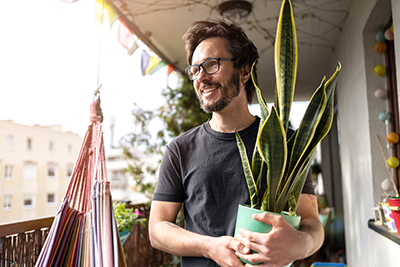 Man holding a pot plant